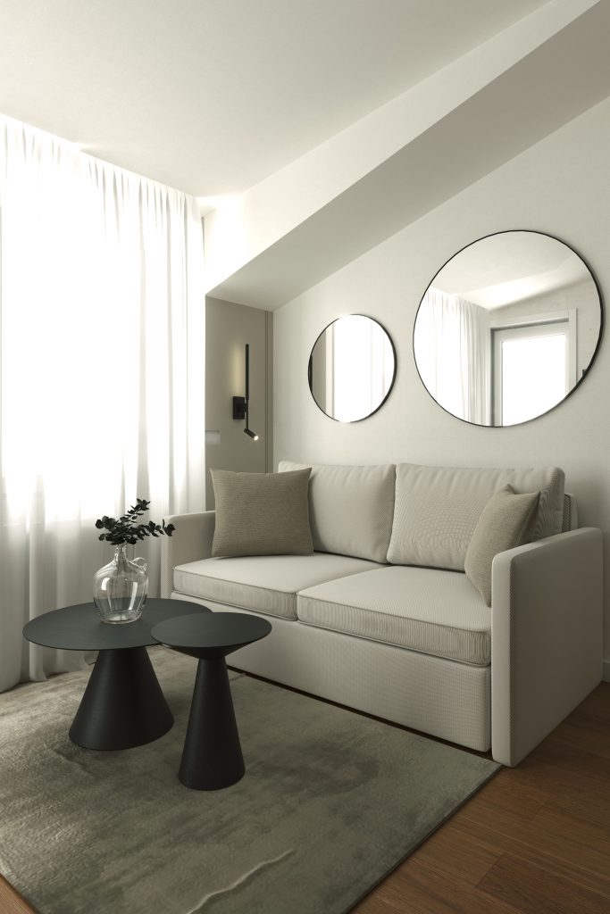 Dizajn enterijera male dnevne sobe sa belom sofom, okruglim ogledalima i crnim klub stolovima