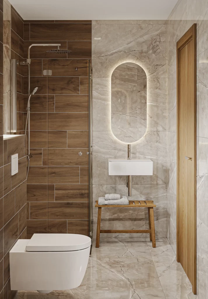 Enterijer kupatila sa tuš kabinom i ovalnim ogledalom sa LED osvetljenjem