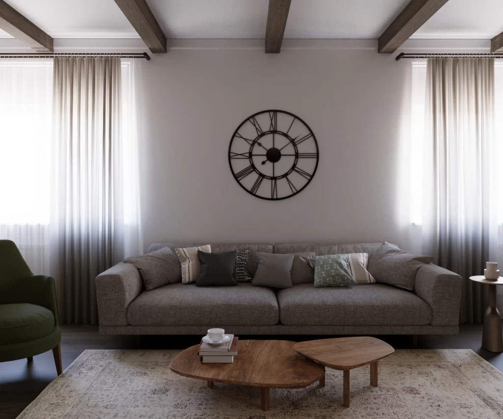 Siva sofa ispred zida sa velikim metalnim zidnim satom